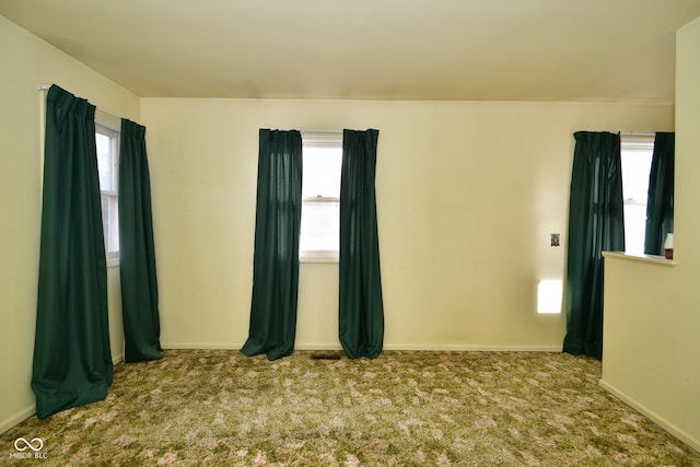 unfurnished room with light colored carpet