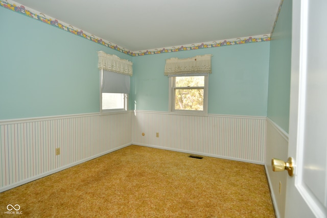 empty room with light colored carpet