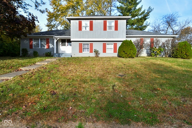 split level home with a front lawn