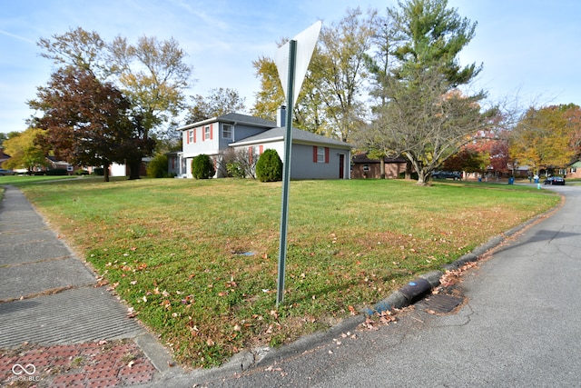 view of property exterior with a yard