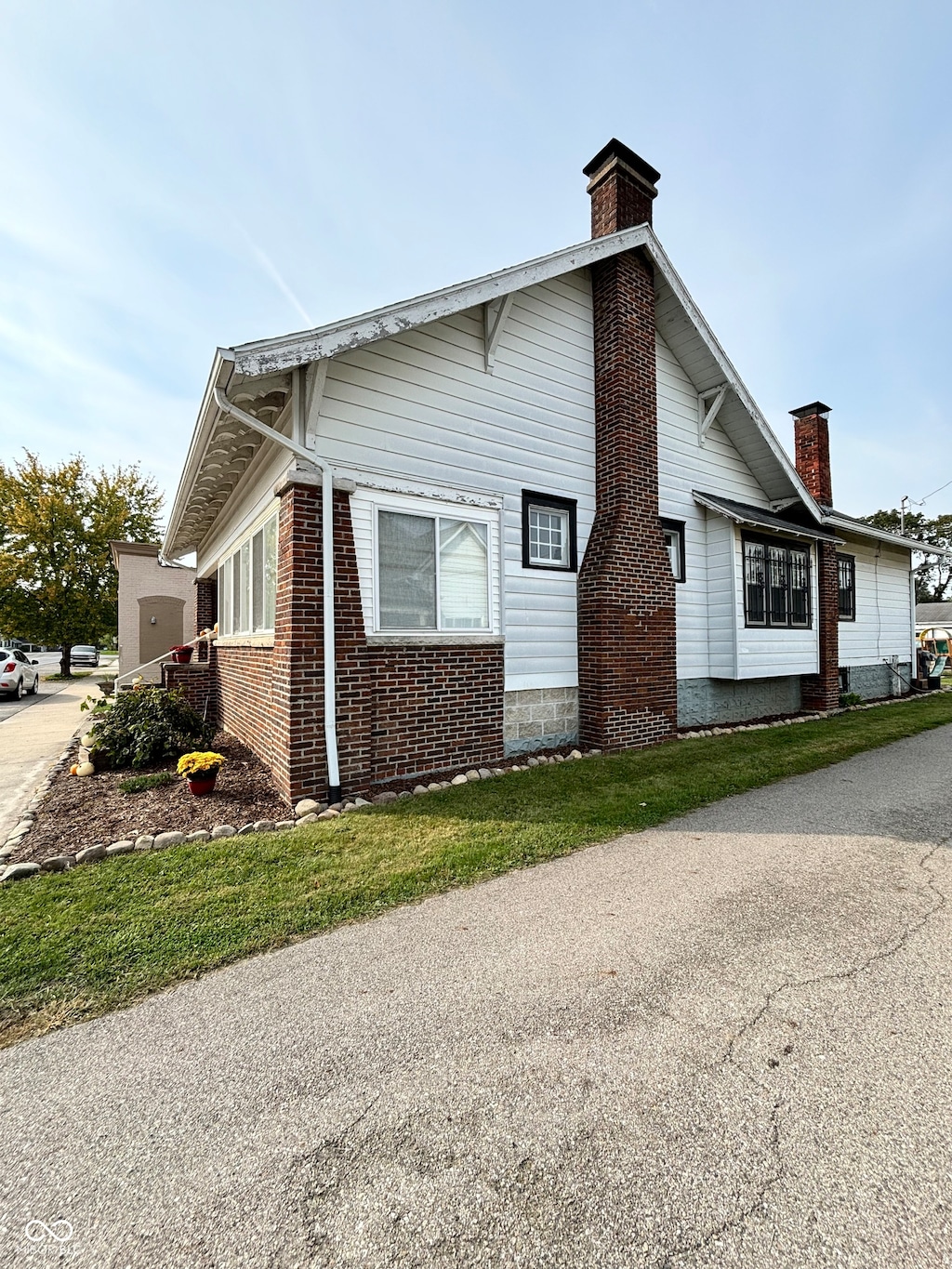 view of side of home featuring a lawn