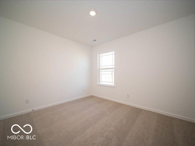 empty room featuring carpet floors