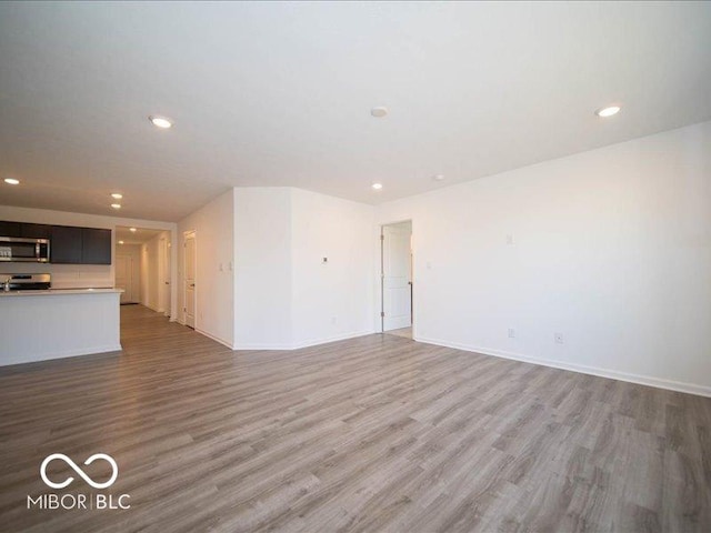 unfurnished living room featuring wood-type flooring