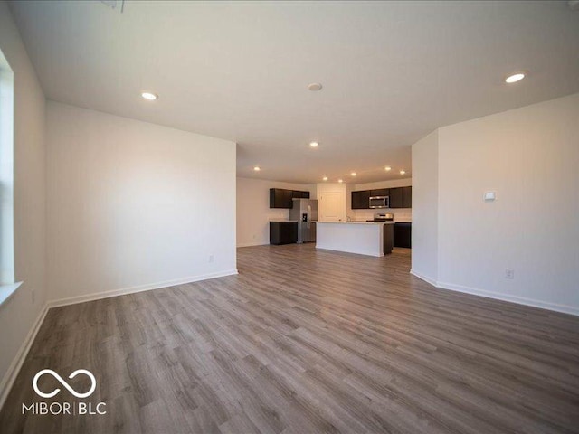 unfurnished living room featuring dark wood-type flooring