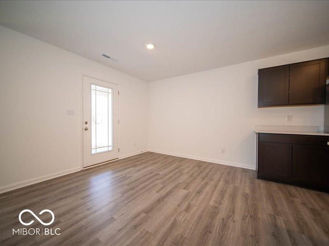 unfurnished living room featuring wood-type flooring