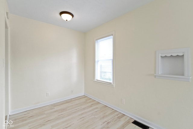 empty room featuring light hardwood / wood-style floors