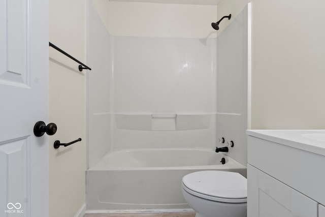 full bathroom featuring vanity, tub / shower combination, and toilet