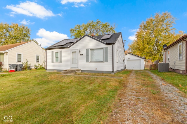 bungalow-style house with a front lawn, central AC, an outbuilding, and a garage