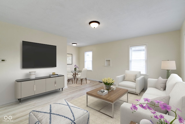 living room featuring light hardwood / wood-style flooring and a wealth of natural light