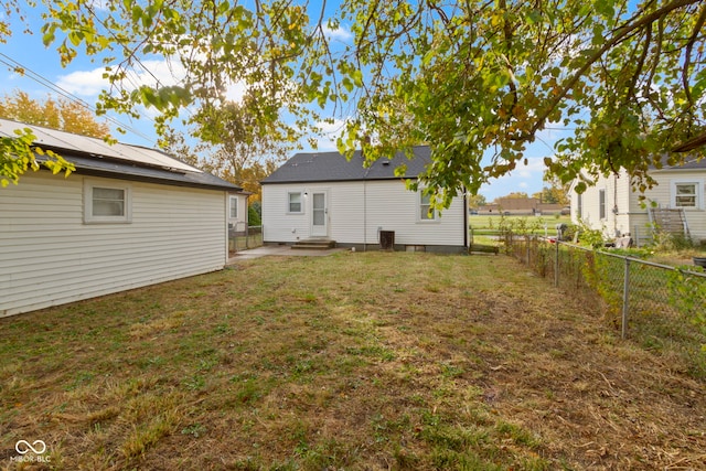 back of property with a patio and a lawn