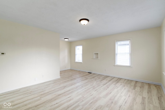 empty room featuring light hardwood / wood-style floors