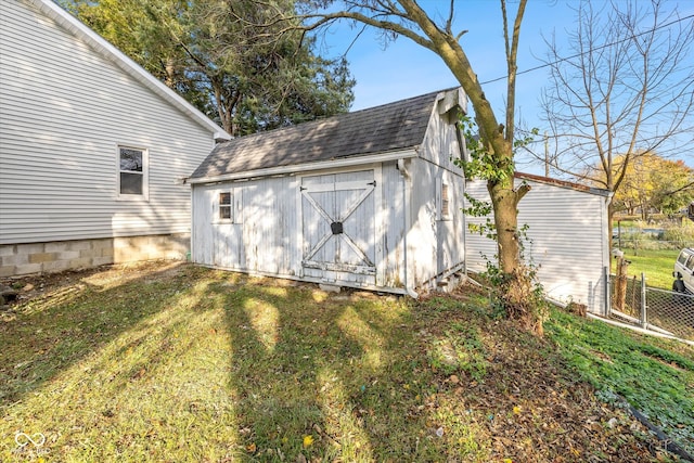 view of outbuilding featuring a yard