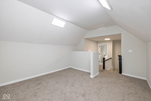 additional living space with light carpet and lofted ceiling