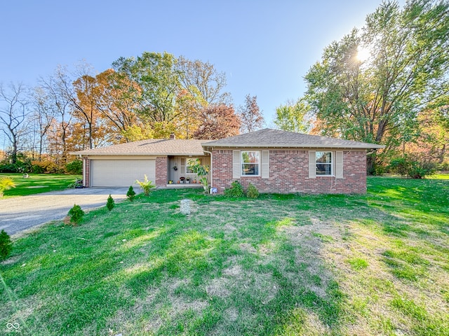 ranch-style home with a front lawn and a garage