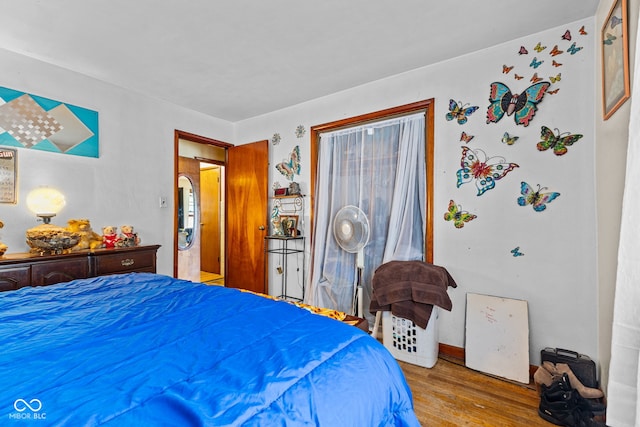 bedroom with light hardwood / wood-style floors