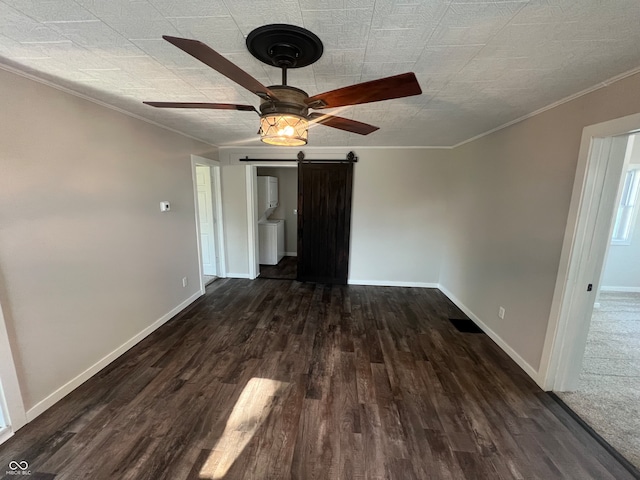 interior space featuring ceiling fan, dark hardwood / wood-style flooring, a barn door, and ornamental molding