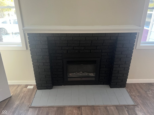 room details featuring a fireplace and hardwood / wood-style floors