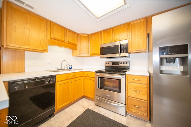 kitchen with sink and appliances with stainless steel finishes