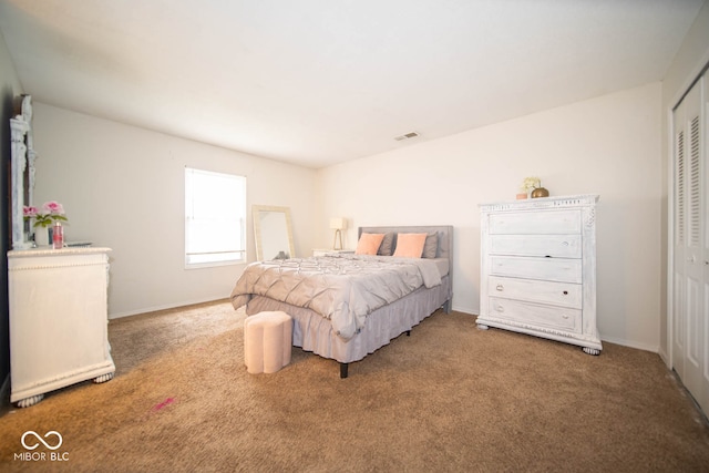 bedroom with a closet and carpet flooring