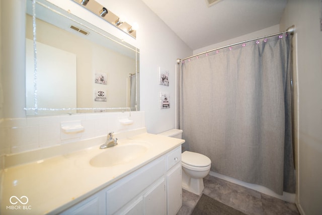 bathroom with vanity, tile patterned floors, toilet, and a shower with curtain