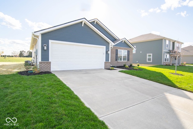 view of front of house featuring a garage and a front lawn