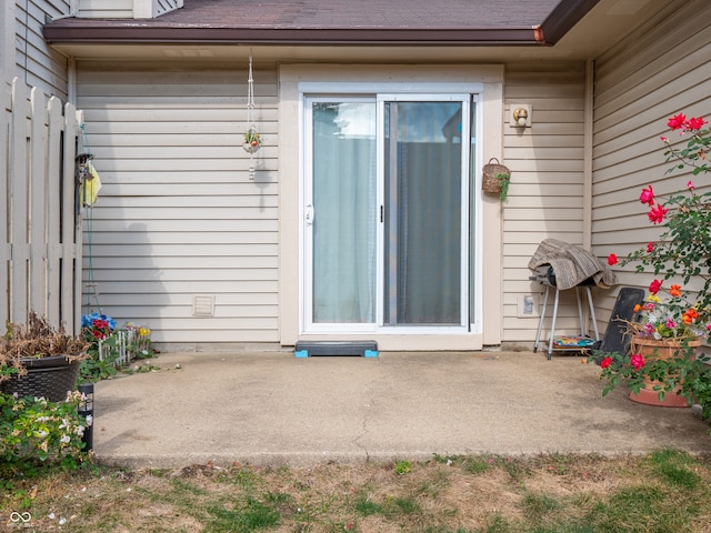 entrance to property featuring a patio area