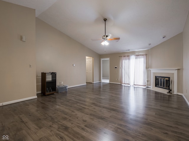 unfurnished living room with lofted ceiling, dark wood-type flooring, and ceiling fan