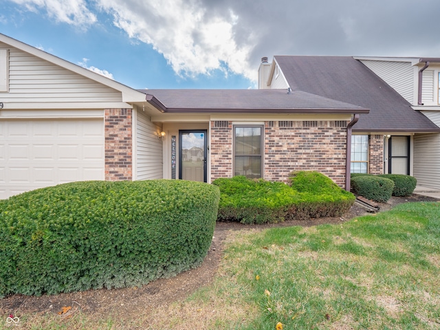 single story home with a garage