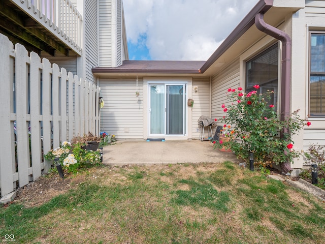 exterior space with a patio area and a lawn