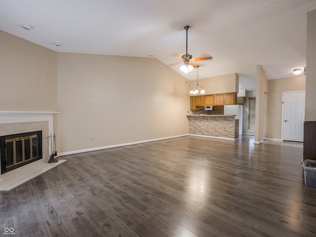 unfurnished living room featuring dark wood-type flooring, lofted ceiling, and ceiling fan