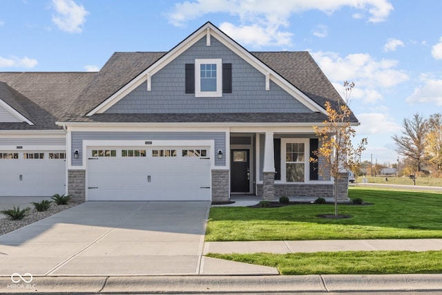 craftsman-style home with a garage and a front yard