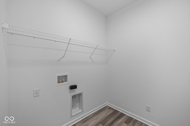 clothes washing area with hardwood / wood-style floors, washer hookup, and hookup for an electric dryer