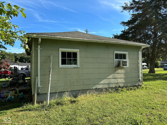 view of side of home featuring a lawn