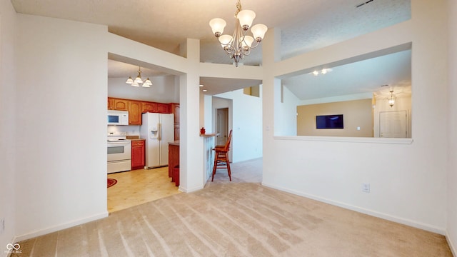 interior space with light carpet, a textured ceiling, vaulted ceiling, and a chandelier