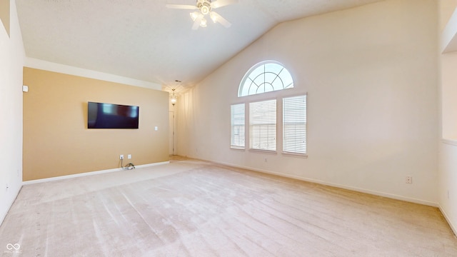 unfurnished living room featuring light colored carpet, high vaulted ceiling, and ceiling fan