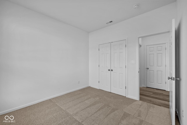 10549 Maidenhair Dr, Indianapolis, IN 46239 - unfurnished bedroom featuring carpet, baseboards, and a closet