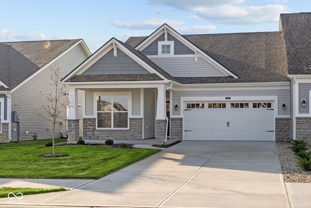 10549 Maidenhair Dr, Indianapolis, IN 46239 - craftsman-style house with stone siding, concrete driveway, a garage, and a front yard
