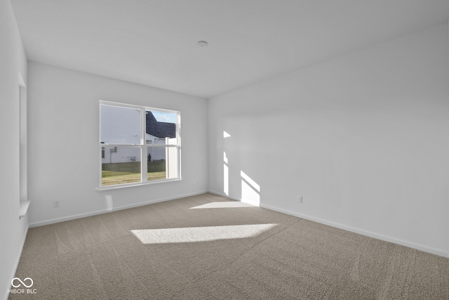 empty room with light colored carpet