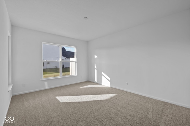 10549 Maidenhair Dr, Indianapolis, IN 46239 - carpeted empty room featuring baseboards