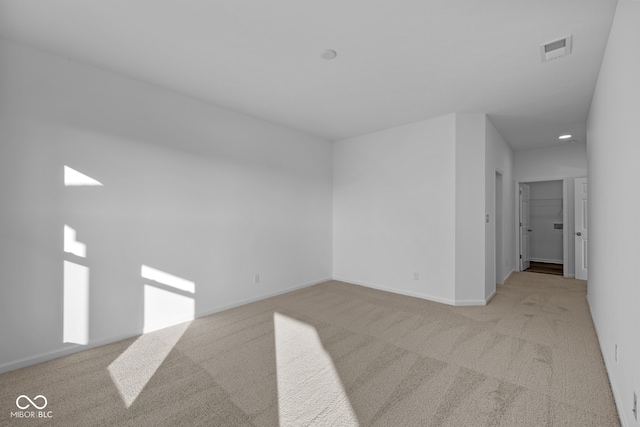 empty room featuring light colored carpet