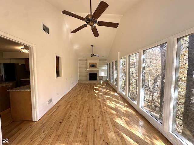 unfurnished sunroom featuring vaulted ceiling and ceiling fan