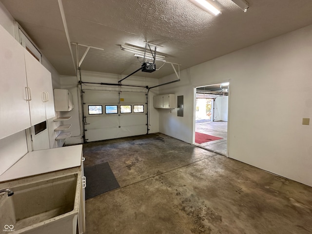 garage featuring a garage door opener and electric panel