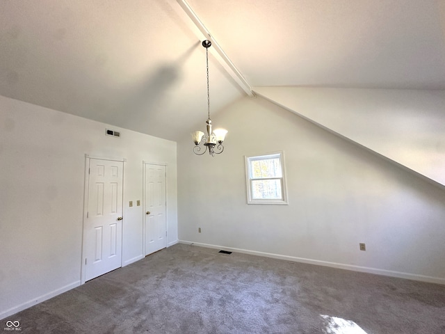 interior space with lofted ceiling, a chandelier, and carpet floors