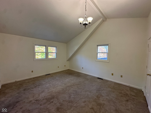 bonus room with a wealth of natural light, lofted ceiling with beams, and dark colored carpet