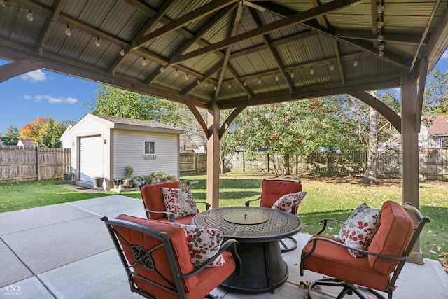 view of patio with a gazebo and a storage unit