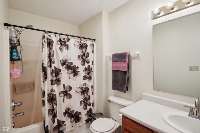 full bathroom featuring vanity, toilet, shower / bath combination with curtain, and a textured ceiling