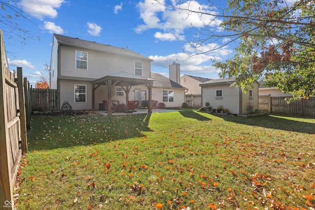 back of property featuring a patio area and a lawn