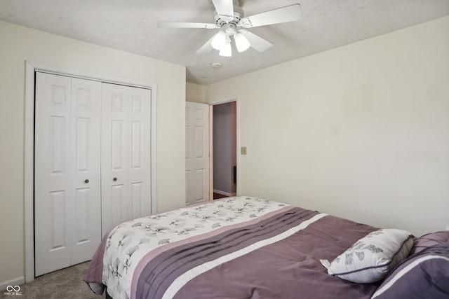 carpeted bedroom featuring a textured ceiling, a closet, and ceiling fan