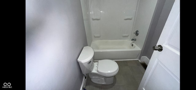 bathroom featuring toilet and tub / shower combination