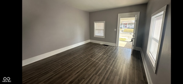 empty room featuring dark hardwood / wood-style floors